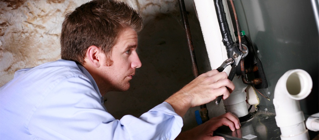 Hvac Tech Installing Furnace